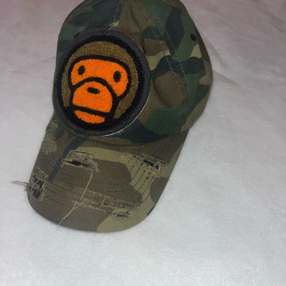 Camouflage Green Hat with Orange “Baby Milo” Logo